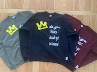 three sweatshirts with a crown on them