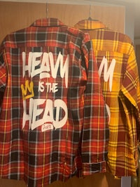 two plaid flannel shirts with the words'heath is the head'on them