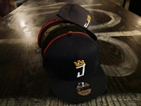 two hats with the letter j on them